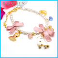 Bracelet en métal rose avec des nœuds papillon # 31449